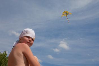 Boy plays kite