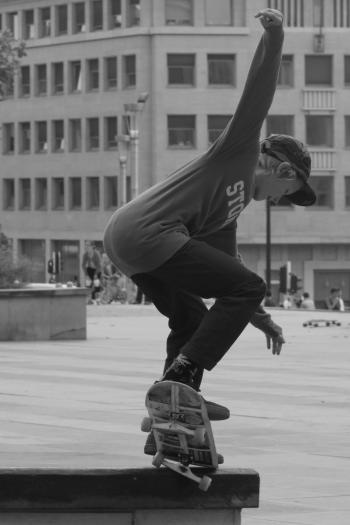 Boy Skateboarding Grayscale Photography