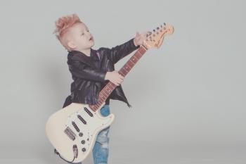 Boy Wearing Black Jacket Holding Electric Guitar