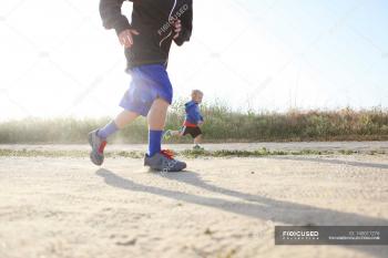 Two boys running outdoors — Stock Photo | #140011276