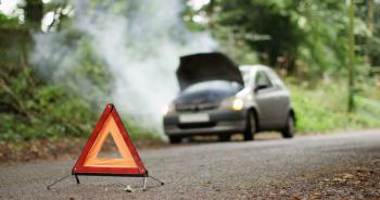 4K Broken down car with smoking engine left abandoned on quiet ...