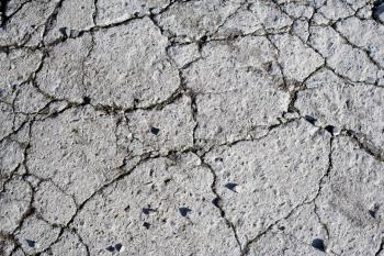 Damaged and broken asphalt background, texture