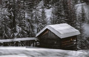 Brown Wooden Barn during Snow