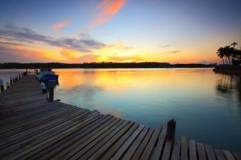 Brown Wooden Dock on Body of Water during Twilight