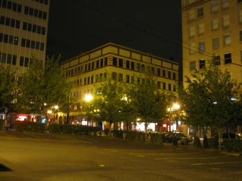 Buildings and parking lot at night