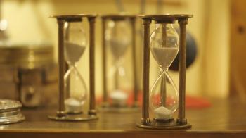 Three white sand hourglasses Stock Video Footage - Videoblocks