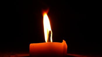 Shimmering light from burning candle at wind, open flame Stock Video ...