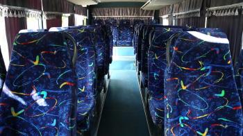 Empty interior of minibus. Bus interior with blue chair. Empty seats ...