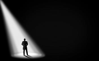 Businessman Alone in the Dark - Under the Spotlight - With Copyspace