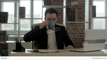 Businessman With A Laptop And Tea Looking At His Watch Stock video ...