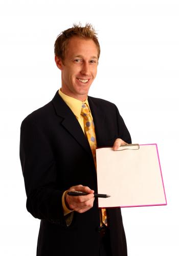 Businessman holding a clipboard and pen