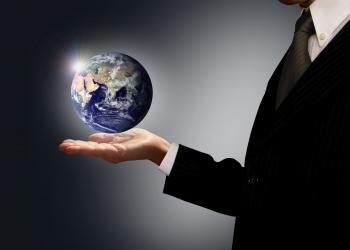Businessman holding Earth globe - Globalization concept