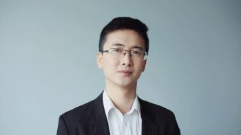 Portrait of a successful young chinese officer manager looks at ...