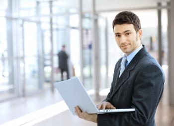 Businessman using laptop - Martinsburg College
