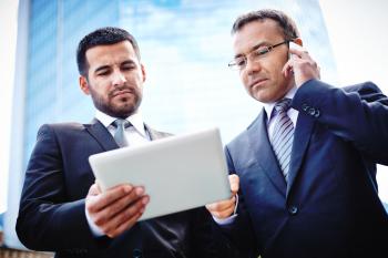 Experienced businessmen discussing details of the project and ne ...