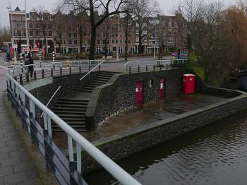 Canal water & bridge in Amsterdam city; Dutch photo by Fons Heijnsbroek