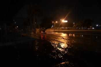 Car splash flooded king tide street 395