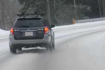 Car turning on snowy road