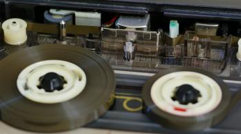 Close up of reel to reel mechanism playbacks older cassettes. Tape ...