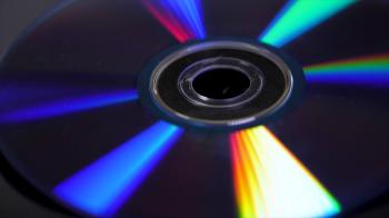 Compact disk isolated on black background. Abstract macro close up ...