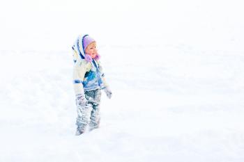 Child Playing in Winter