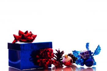Christmas ornaments and gift box on white