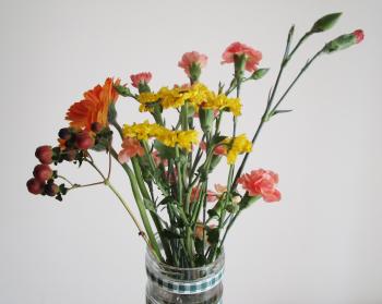 Clear Glass Vase With Red and Yellow Flowers