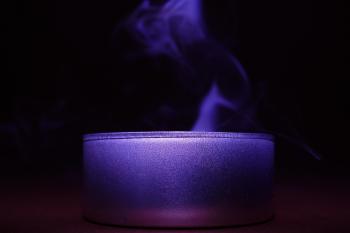 Close-up of Blue Candle Against Black Background