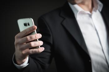 Close-up of Man Using Mobile Phone