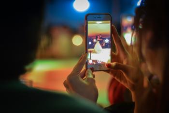 Close-up of Woman Using Mobile Phone at Night
