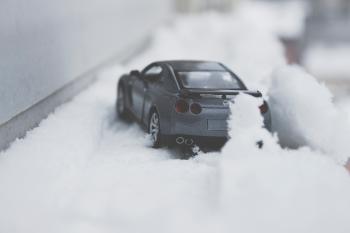 Close-up Photo of Toy Car on Snow