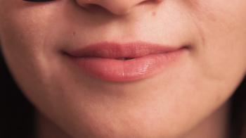 Extreme close up of lips 18-year-old girl with smile. Without ...