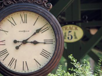 Closeup of a clock at a railroad station