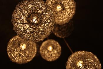 Closeup Photo of Brown Round Twig Pendant Lamps