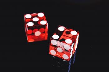Closeup Photo of Two Red Dices Showing 4 and 5