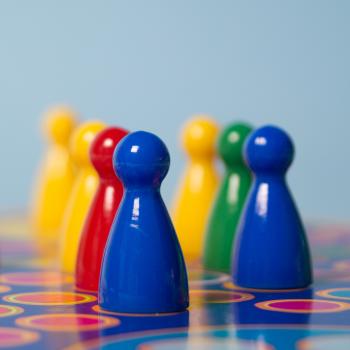 Closeup Photography of Yellow, Red, Green, and Blue Chess Piece