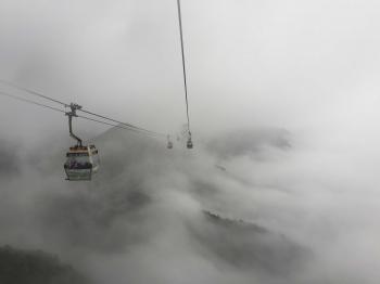 Mystic Ngong Ping 360 Cable Car during a cloudy and foggy day ...