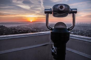 Coin-operated Tower Viewer on Rooftop during Sunset