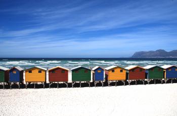 Colorful Cottages Near the Sea Under Blue Sky during Daytime