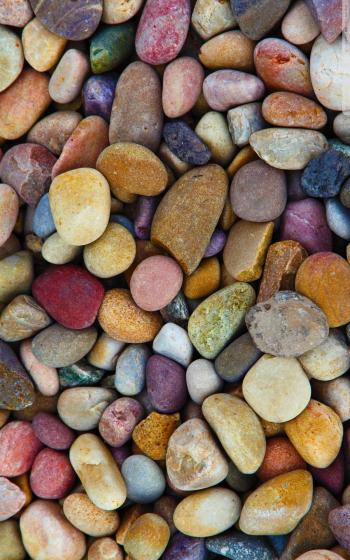 Pebbles of all chakra colors, greens, candles flowers, some fine ...