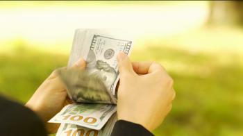 Person counting stack of 100 dollar bills outside Stock Video ...