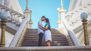 Couple Standing By The Stairs