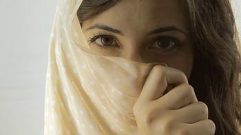 Vintage girl mystery shy covered face CU CC. A beautiful young woman ...