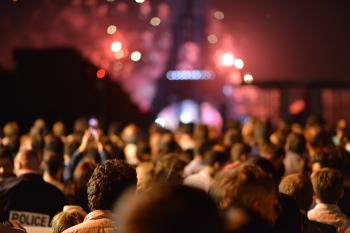 Crowd in front of fireworks at Eiffel Tower
