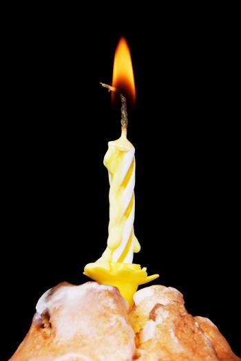 Cupcake with burning candle