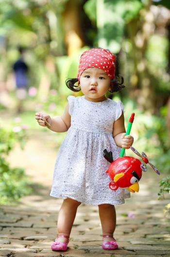 Cute Baby Girl with Angry Birds Toy