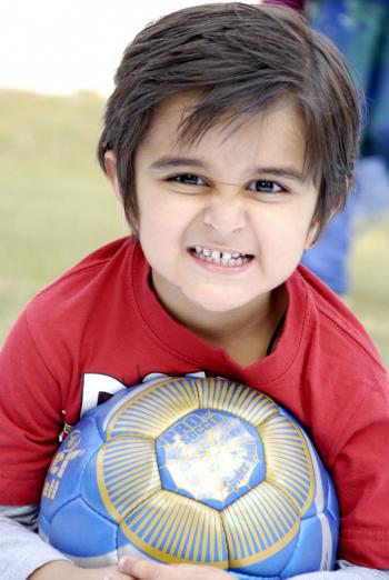 Cute Child With Football