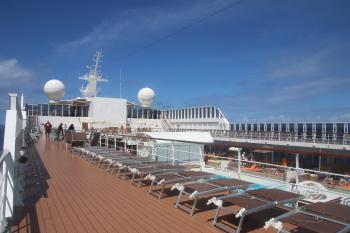 Deck of the ship with sun beds and pool