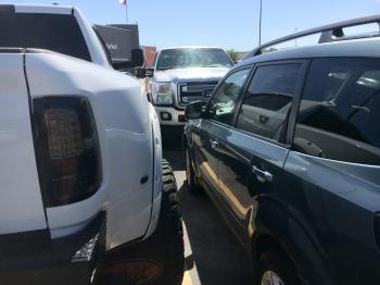 Dually pickup almost wider than the parking space.