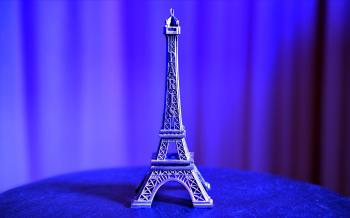 Eiffel Tower Miniature on Blue Textile